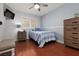 Bedroom with wood floors, ceiling fan, and ample natural light at 1839 Thunder Mountain Dr, Henderson, NV 89012