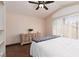 Bright bedroom with wood floors features a ceiling fan and shuttered window at 1839 Thunder Mountain Dr, Henderson, NV 89012