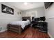 Bedroom with light walls, wood floors, and a desk at 1839 Thunder Mountain Dr, Henderson, NV 89012