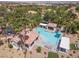 A community pool with a hot tub, multiple lounge areas, and desert landscaping at 1839 Thunder Mountain Dr, Henderson, NV 89012