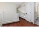 Upstairs hallway features wood floors and updated railing at 1839 Thunder Mountain Dr, Henderson, NV 89012