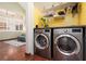 Convenient laundry room with washer, dryer, and shelving at 1839 Thunder Mountain Dr, Henderson, NV 89012