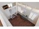 Aerial view of a well-lit living room featuring two chairs, modern decor, and hardwood floors at 1839 Thunder Mountain Dr, Henderson, NV 89012