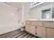 Bathroom featuring a vanity, tub-shower combination, mirror, and laminate flooring at 1881 W Alexander Rd # 1092, North Las Vegas, NV 89032