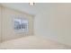 Carpeted bedroom featuring a large window providing natural light at 1881 W Alexander Rd # 1092, North Las Vegas, NV 89032