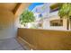 Private patio showcasing textured stucco walls with a view of the well-kept building exterior at 1881 W Alexander Rd # 1092, North Las Vegas, NV 89032