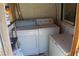 A laundry room featuring a washer, dryer, and some storage space at 192 W Alma Ave, Overton, NV 89040