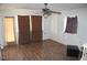 This living room showcases wood flooring, a ceiling fan, and neutral wall colors at 192 W Alma Ave, Overton, NV 89040