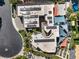 Unique home rooftop with solar panels, shade canopies, and tropical landscaping visible from an aerial perspective at 2017 Slow Wind St, Las Vegas, NV 89134