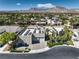 Stunning aerial view of a modern home with solar panels, a three-car garage, and meticulously manicured landscaping at 2017 Slow Wind St, Las Vegas, NV 89134