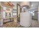 Large bathroom with stone tile, vanity, shower, and open layout at 2017 Slow Wind St, Las Vegas, NV 89134