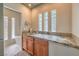 Bright bathroom with glass block window details and a tiled countertop at 2017 Slow Wind St, Las Vegas, NV 89134