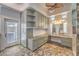 Luxurious bathroom featuring custom cabinets, vanity, and tile flooring at 2017 Slow Wind St, Las Vegas, NV 89134