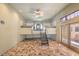 Unique bedroom space with lofted beds, tile floors, and glass doors to the exterior at 2017 Slow Wind St, Las Vegas, NV 89134