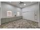 Bedroom featuring stone floors, custom built-in storage, and a large wardrobe at 2017 Slow Wind St, Las Vegas, NV 89134