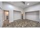 Large bedroom featuring stone floors with access to the bathroom and closet area at 2017 Slow Wind St, Las Vegas, NV 89134