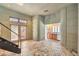 Bonus room with unique architectural details and staircase, tile floors, and wet bar at 2017 Slow Wind St, Las Vegas, NV 89134