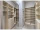 Spacious walk-in closet featuring custom shelving and drawers, offering ample storage space at 2017 Slow Wind St, Las Vegas, NV 89134