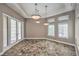 Open dining area with decorative lighting, neutral color palette, and views of outdoor living at 2017 Slow Wind St, Las Vegas, NV 89134