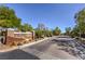 Welcome to Desert Trails, a gated community with well-maintained landscaping and a beautiful entrance at 2017 Slow Wind St, Las Vegas, NV 89134