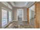 Hallway featuring glass doors to the pool area, a walk-in pantry and barn-style doors at 2017 Slow Wind St, Las Vegas, NV 89134