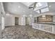 Bright kitchen with skylights, dining table, and an island with white wood accents at 2017 Slow Wind St, Las Vegas, NV 89134