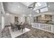 Bright kitchen with skylights, dining table, and an island with white wood accents at 2017 Slow Wind St, Las Vegas, NV 89134