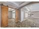 A hallway featuring barn-style doors leading to a living area and outdoor access to the pool at 2017 Slow Wind St, Las Vegas, NV 89134
