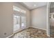 View of a room featuring tiled floors and direct access to the outside through glass double doors at 2017 Slow Wind St, Las Vegas, NV 89134