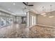 Large living room boasts a ceiling fan, decorative lighting, tiled floors, and natural light at 2017 Slow Wind St, Las Vegas, NV 89134