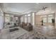 Spacious living room with neutral color palette, open floorplan, and decorative tiling at 2017 Slow Wind St, Las Vegas, NV 89134