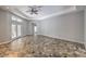 Neutral living room featuring tile flooring, recessed lights and access to the outdoors at 2017 Slow Wind St, Las Vegas, NV 89134