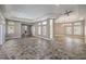 Neutral living room with stone-tiled floors, lots of natural light, and open floor plan at 2017 Slow Wind St, Las Vegas, NV 89134