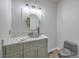 Stylish powder room with vessel sink, modern fixtures, and tile flooring at 2017 Slow Wind St, Las Vegas, NV 89134