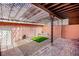 Private backyard with a pergola, gravel, pavers, and artificial grass at 233 Pecos Way, Las Vegas, NV 89121