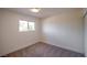 A clean bedroom featuring neutral carpet and a window at 233 Pecos Way, Las Vegas, NV 89121