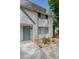 Two-story home featuring neutral-toned walls, a blue door, and green trim at 233 Pecos Way, Las Vegas, NV 89121