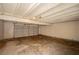 Spacious unfinished garage providing ample storage and parking space at 233 Pecos Way, Las Vegas, NV 89121