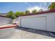 A well-maintained, white, two-car garage at 233 Pecos Way, Las Vegas, NV 89121