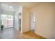 Bright hallway with light wood floors and access to the bathroom at 233 Pecos Way, Las Vegas, NV 89121