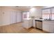 Bright kitchen featuring white cabinetry and stainless steel dishwasher at 233 Pecos Way, Las Vegas, NV 89121