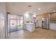 Updated kitchen with bar, modern cabinets, quartz countertops and stainless steel appliances at 233 Pecos Way, Las Vegas, NV 89121