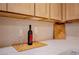 Close-up of kitchen counter with a wine bottle and glasses at 233 Pecos Way, Las Vegas, NV 89121