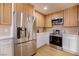 Modern kitchen with stainless steel appliances and light wood cabinetry at 233 Pecos Way, Las Vegas, NV 89121
