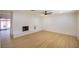 Spacious living room with a decorative brick fireplace and ceiling fan at 233 Pecos Way, Las Vegas, NV 89121
