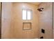 Close-up of a tiled shower with a rain shower head and window at 233 Pecos Way, Las Vegas, NV 89121