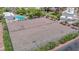 Overhead view of community tennis courts with lush landscaping and lighting at 233 Pecos Way, Las Vegas, NV 89121