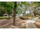Landscaped community with mature trees and paved walkways at 233 Pecos Way, Las Vegas, NV 89121