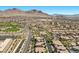 Overhead view of a residential neighborhood with a community park and mountain backdrop at 251 Castellari Dr, Las Vegas, NV 89138