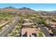 Aerial view of a neighborhood with desert mountains in the background at 251 Castellari Dr, Las Vegas, NV 89138